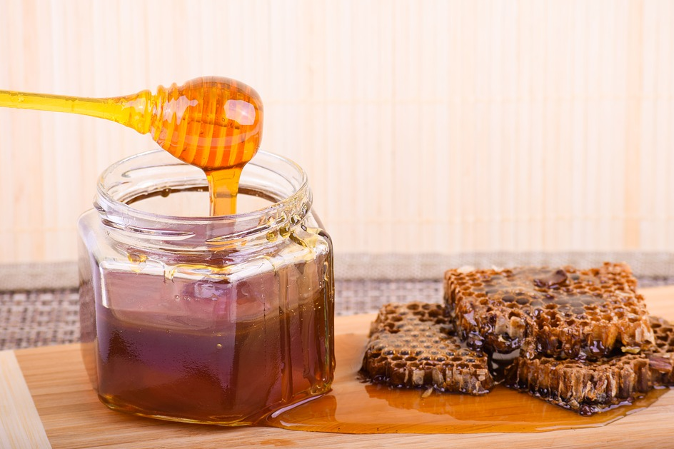 Raw honey in a jar for getting rid of pimple